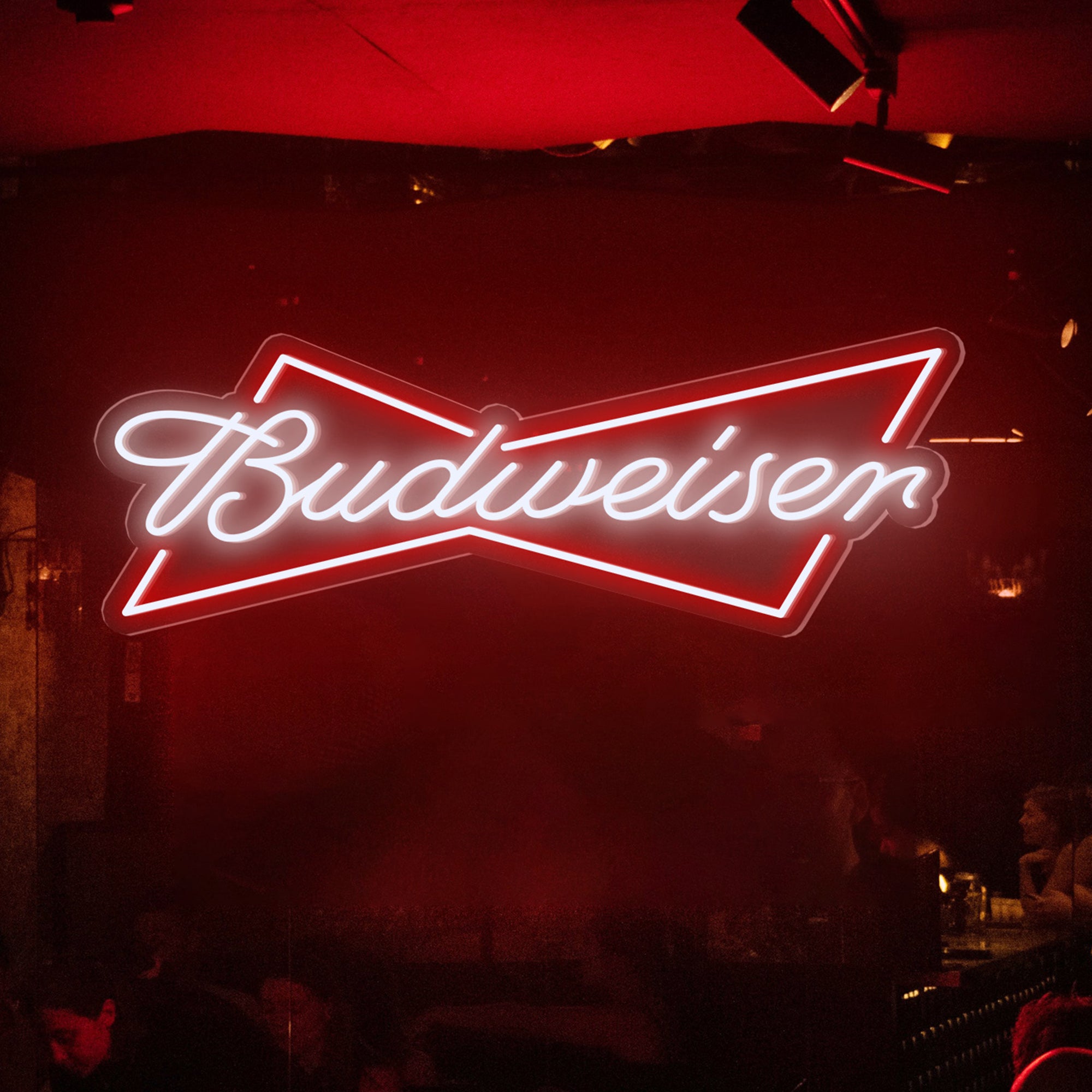 Neon Budweiser sign in a dimly lit bar setting
