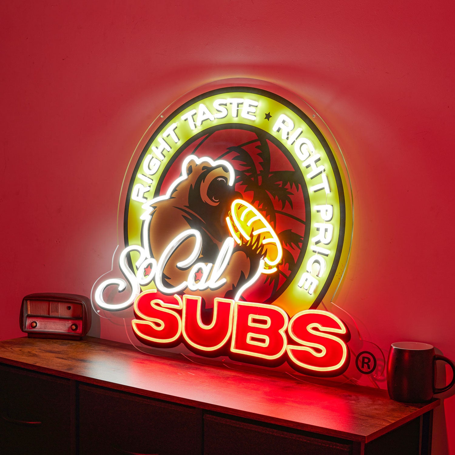 Neon sign for St. Cal Subs on a red background