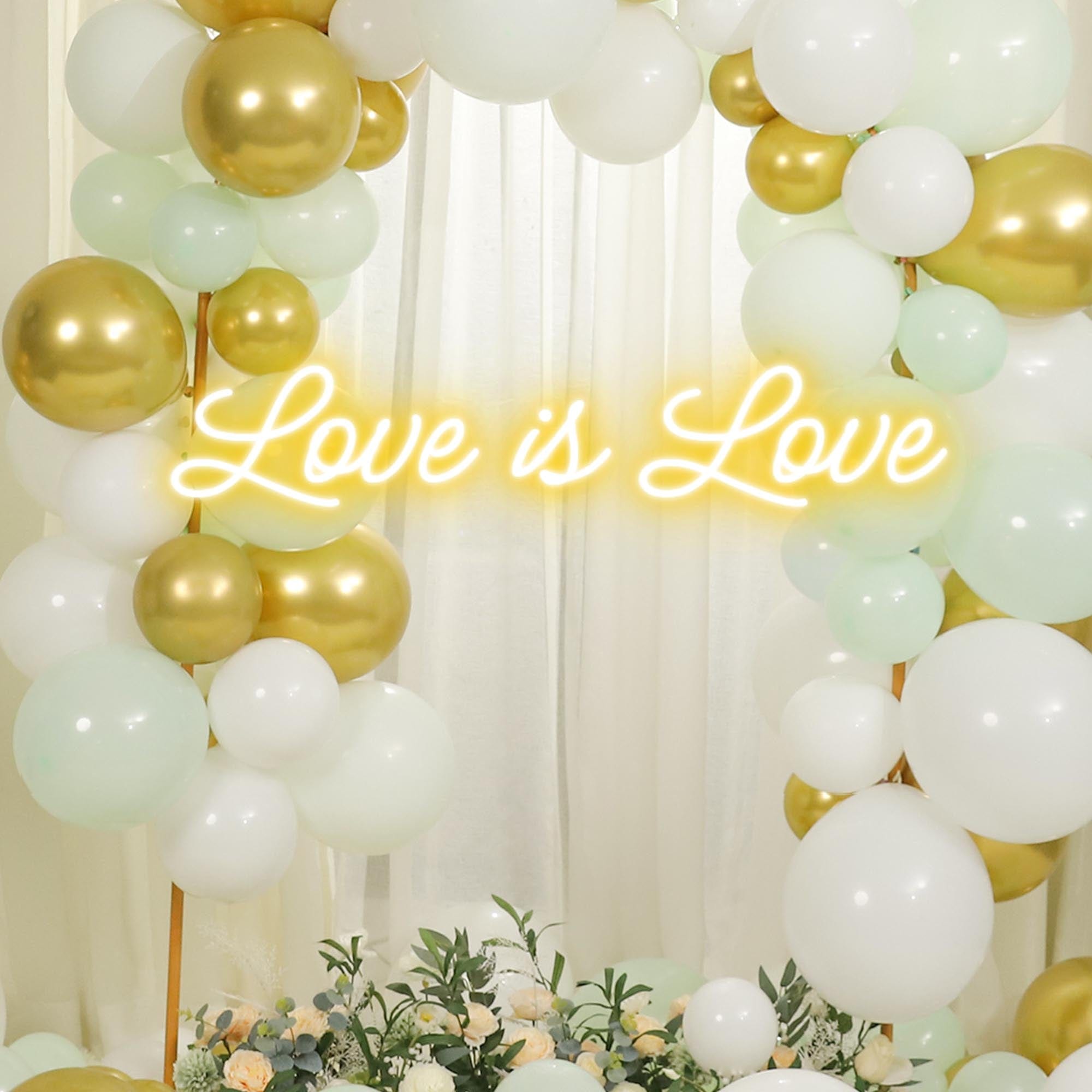 a yellow Love is Love Neon Sign was hung in a wedding ceremony